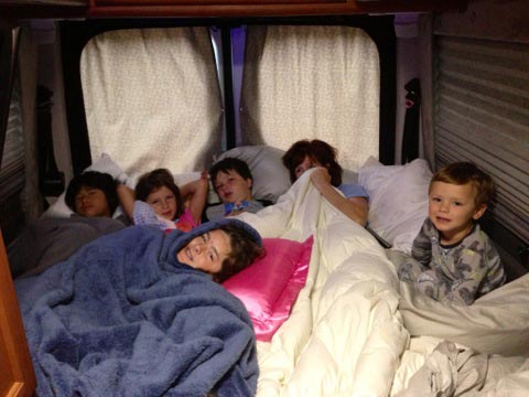 The rear bed in a SOLAR Sprinter Van Camper Rental can be set up as a KING or two TWINS.